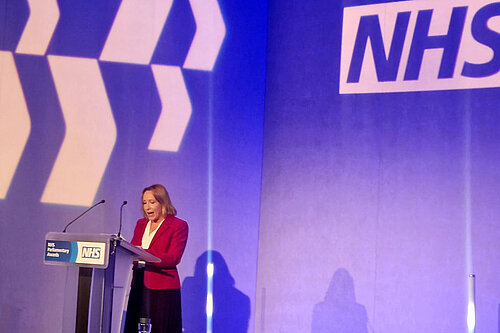 Helen Morgan speaking at an NHS event