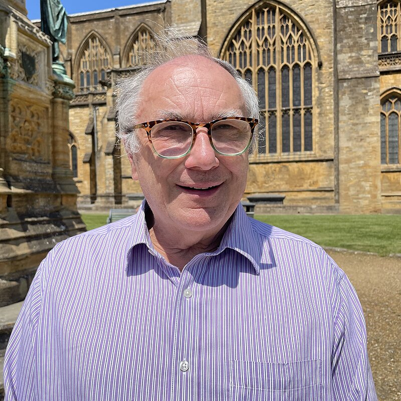 Richard Crabb stood in front of Sherborne Abbey