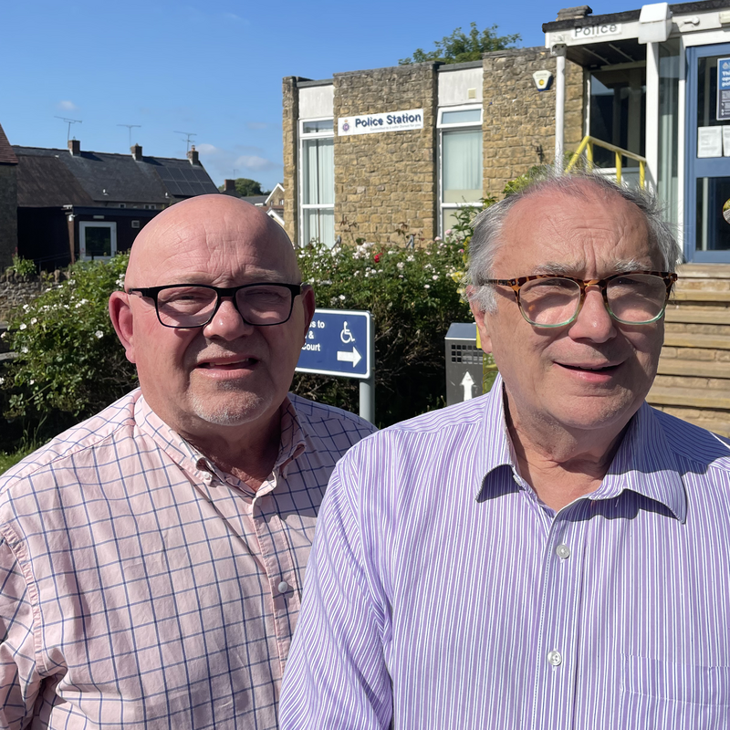 Cllrs Jon Andrews (Left) and Richard Crabb (Right) stood together outside of Sherborne Police Station
