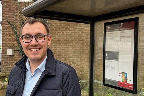 Tom Gordon stood at a bus stop in Harrogate