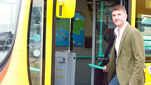 Edward Morello MP getting on a bus