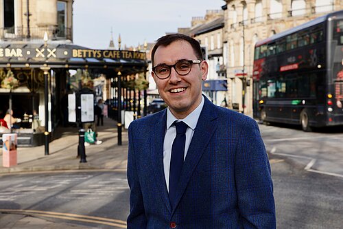 Tom Gordon stood outside Betty's on Parliament, in Harrogate town centre