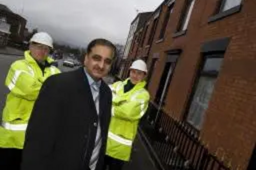 Councillor Ali at the site where the new railings have been fitted