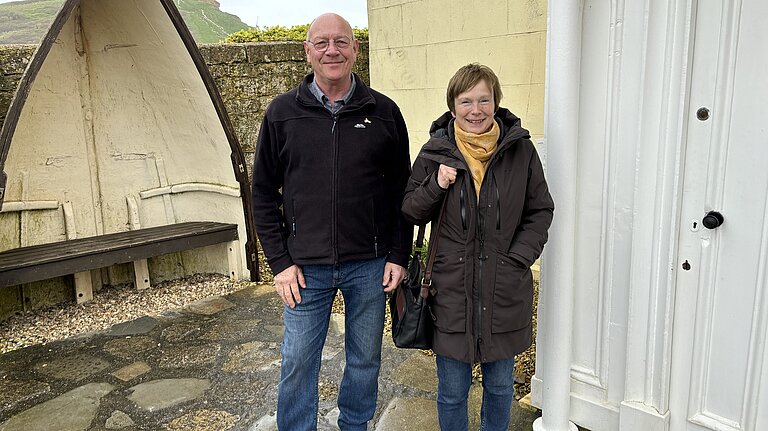 Dave Bolwell and Ann Langridge outside of the West Bay Discovery Centre in West Bay Dave Bolwell, in a black puffer jacket and jeans, and Ann Langridge, in a burgundy jacket with jeans and yellow scarf, stood outside of the West Bay Discovery Centre in West Bay