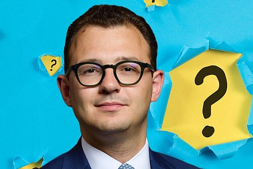 Jack Rankin MP against blue background with torn paper effect showing yellow with black question marks