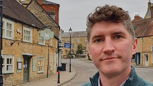 Edward Morello stood cross-armed and smiling in Sherborne