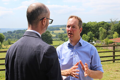 Interview Richard Foord speaking to an interviewer in a field